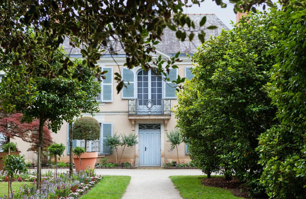 Facade of a classic architecture and garden in France